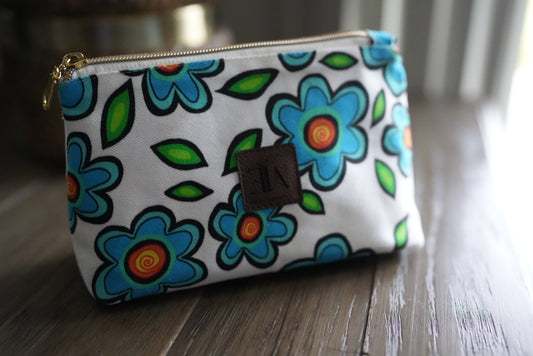 Blue flowers on white make up bag